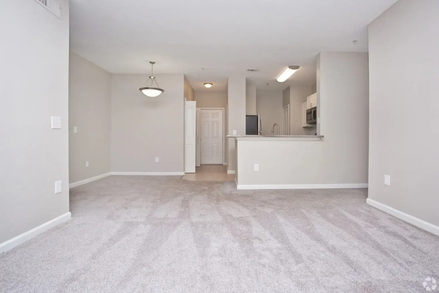 Spacious unfurnished apartment living area with open kitchen at Overlook Ridge