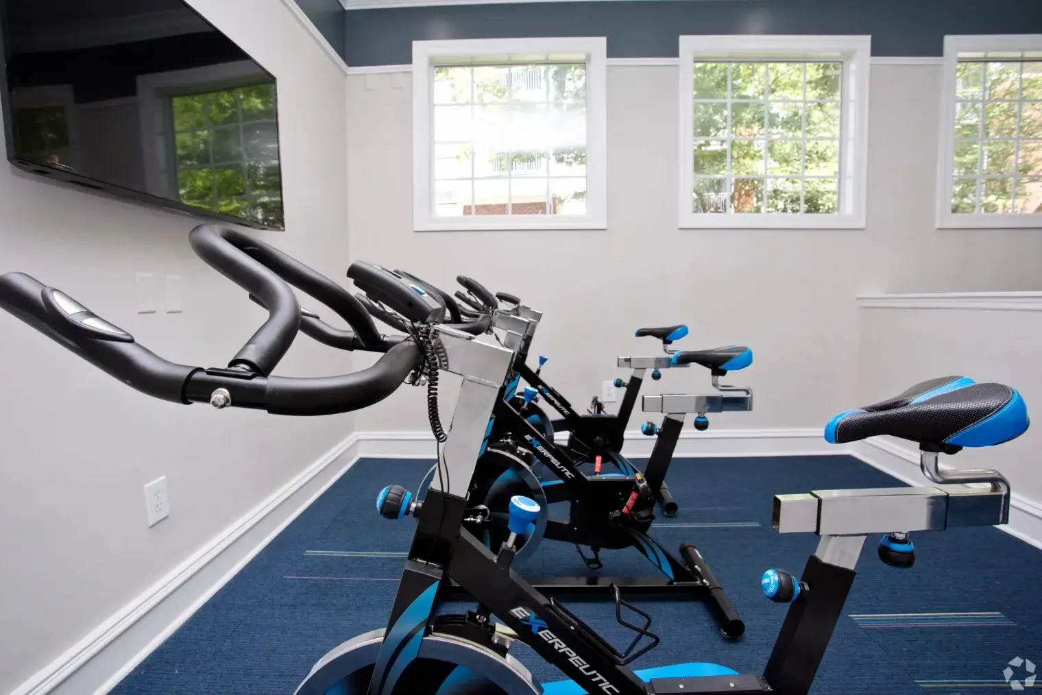 Indoor cycling bikes in the Overlook Ridge apartment fitness center