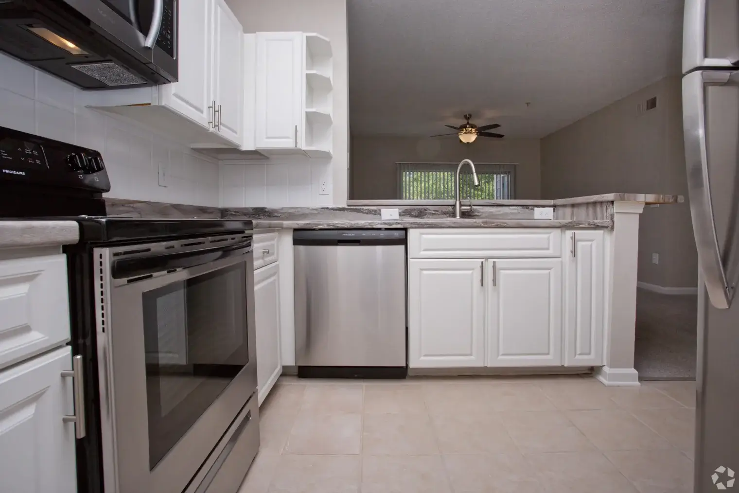 Modern apartment kitchen with stainless steel appliances at Overlook Ridge in Atlanta